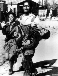 Hector Pieterson being carried away by Mbuyisa Makhubo, with his sister running alongside (Photo by: Sam Nzima)