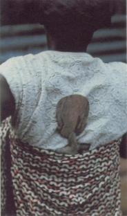 Ghana_Akuaba figurine being carried on the back